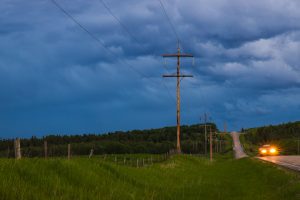 Power lines running alongside a highway in Alberta